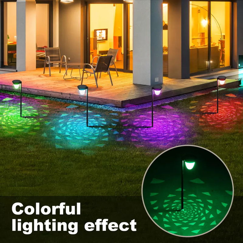 El paisaje accionado solar del pequeño enchufe de tierra enciende las luces solares del jardín para el césped del patio trasero
